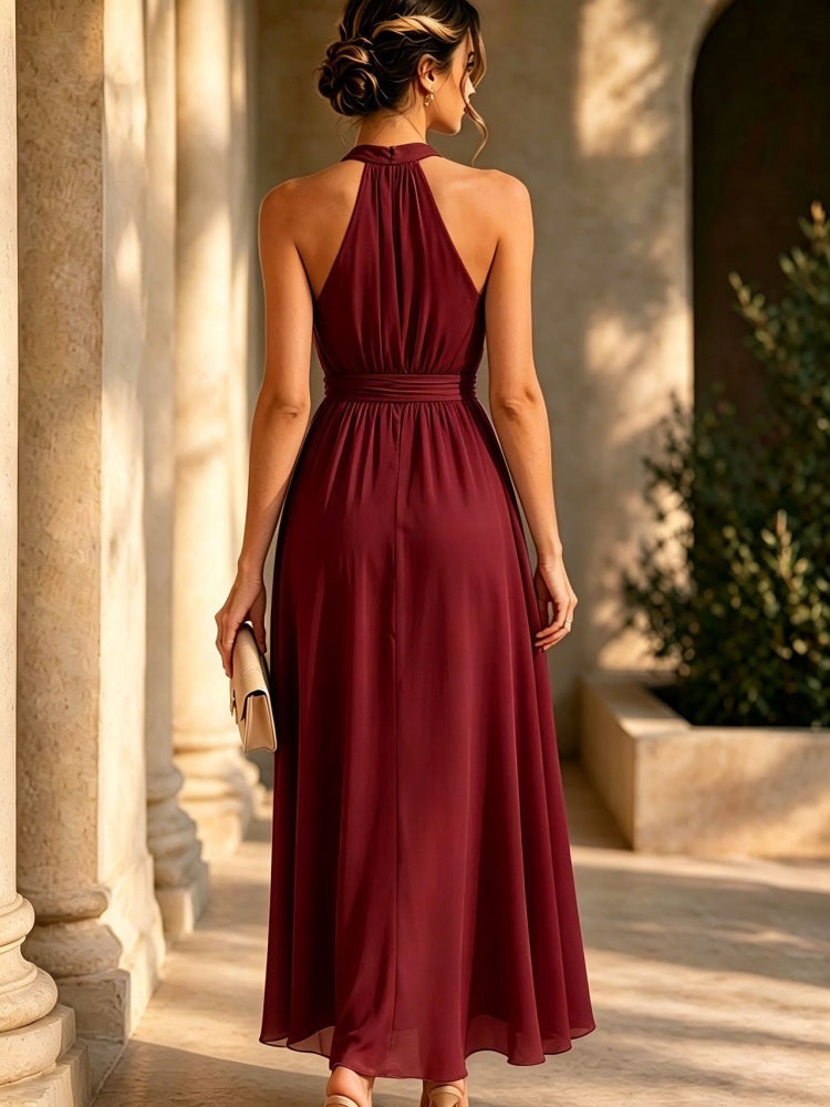 Asymmetric waist-cinching halter dress