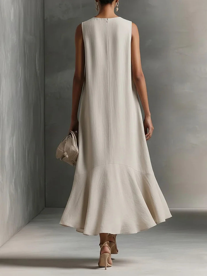 Deep V-neck sleeveless dress with an asymmetrical hem, elegant and slimming
