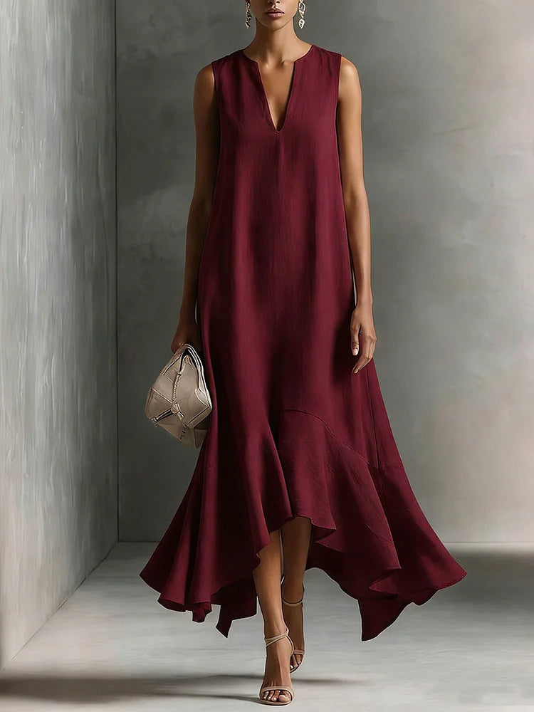 Deep V-neck sleeveless dress with an asymmetrical hem, elegant and slimming