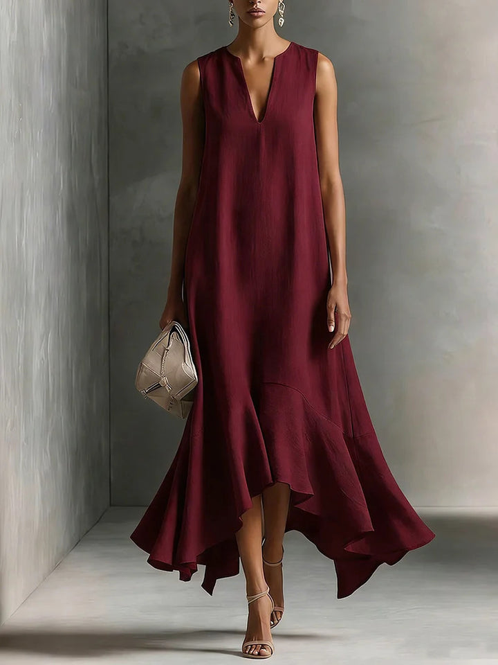 Deep V-neck sleeveless dress with an asymmetrical hem, elegant and slimming